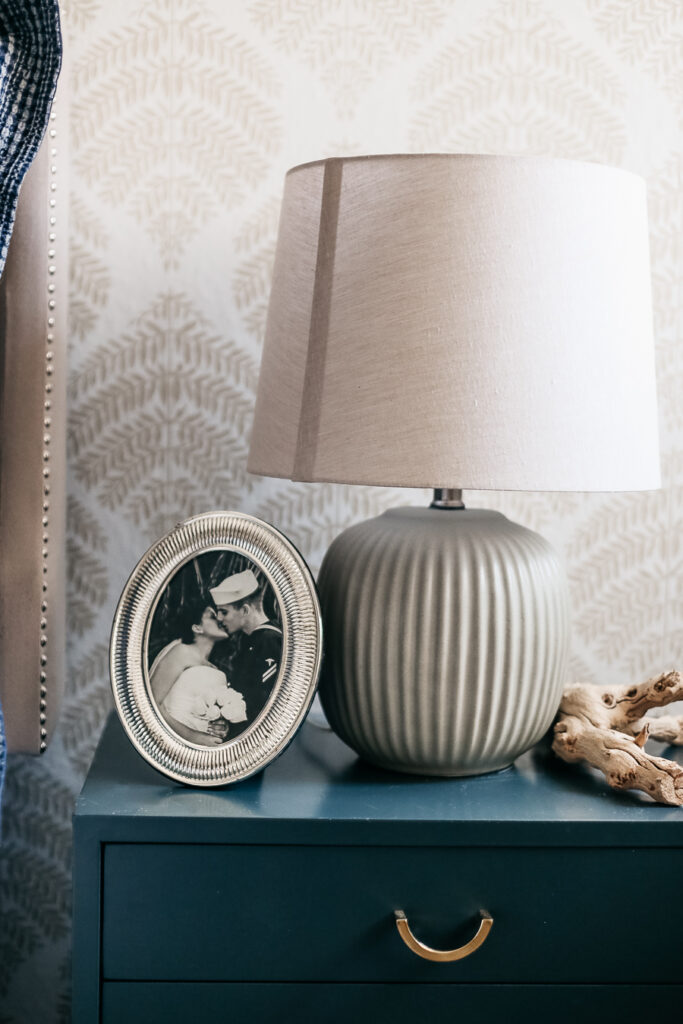 styling a bedside table in a casual coastal bedroom