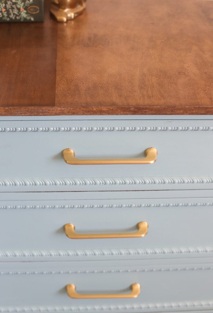 Updating an old dresser with blue paint and brushed gold pulls