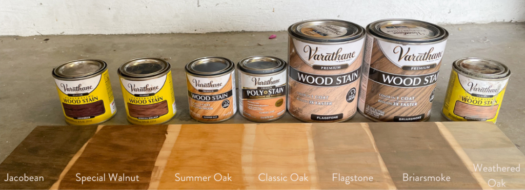 Seven wood stain tins and how they look on a pine board.