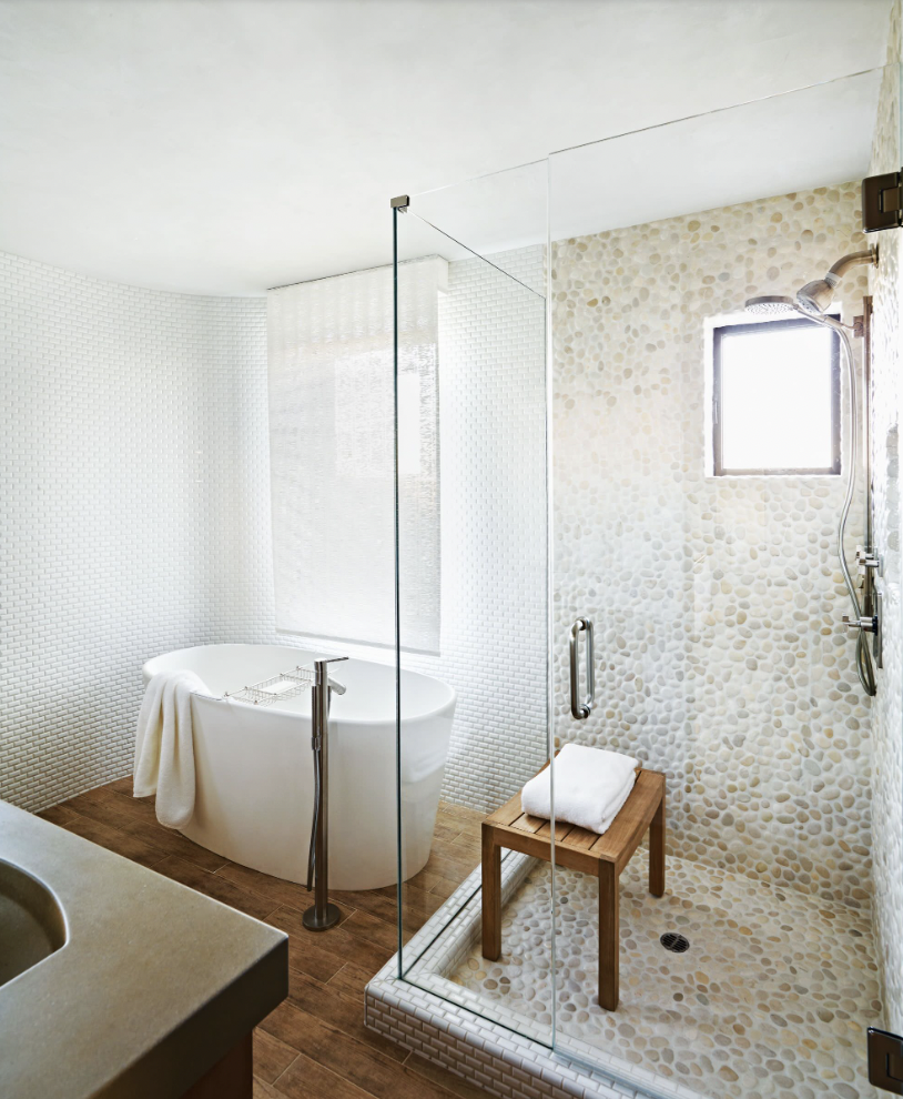 coastal bathroom ideas - pebble tile shower