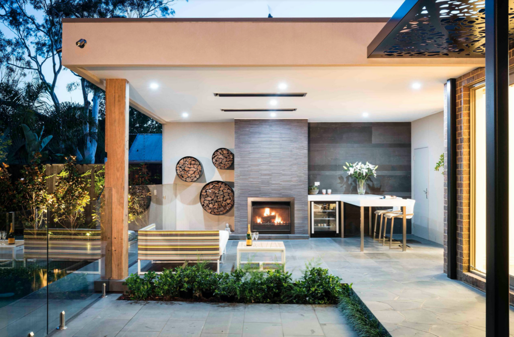 Modern decorative way to store firewood near fireplace.