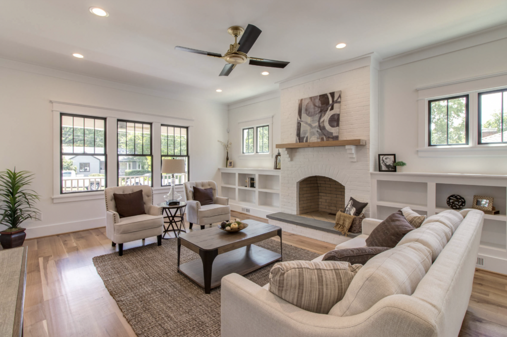 painted white brick fireplace living room with neutral colors