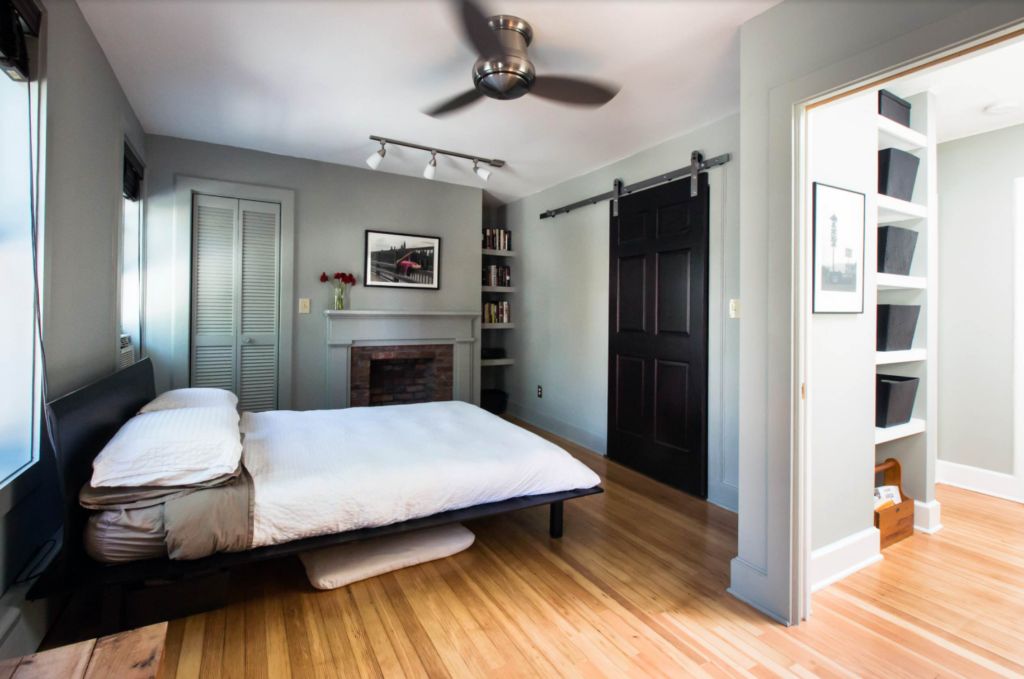 Black barn door used in a bedroom