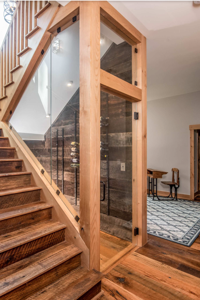 All wood staircase in a rustic farmhouse styled home.