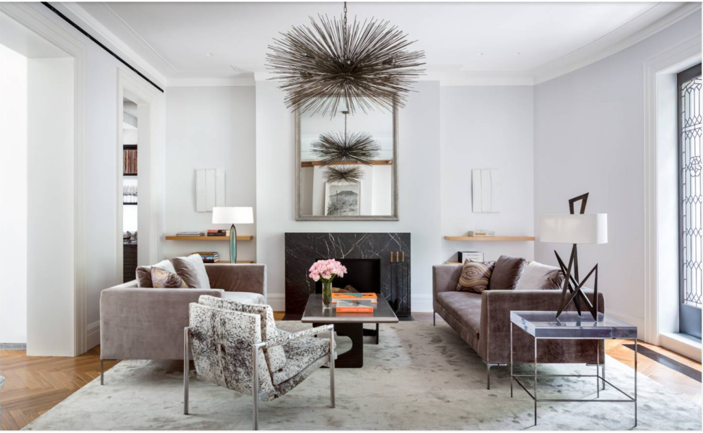 Low floating shelves around a living room fireplace in a modern space. 