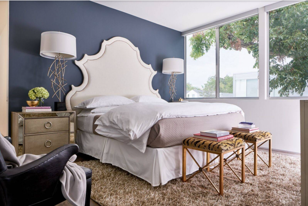Bold and bright paint colors used as an accent wall in a small bedroom.
