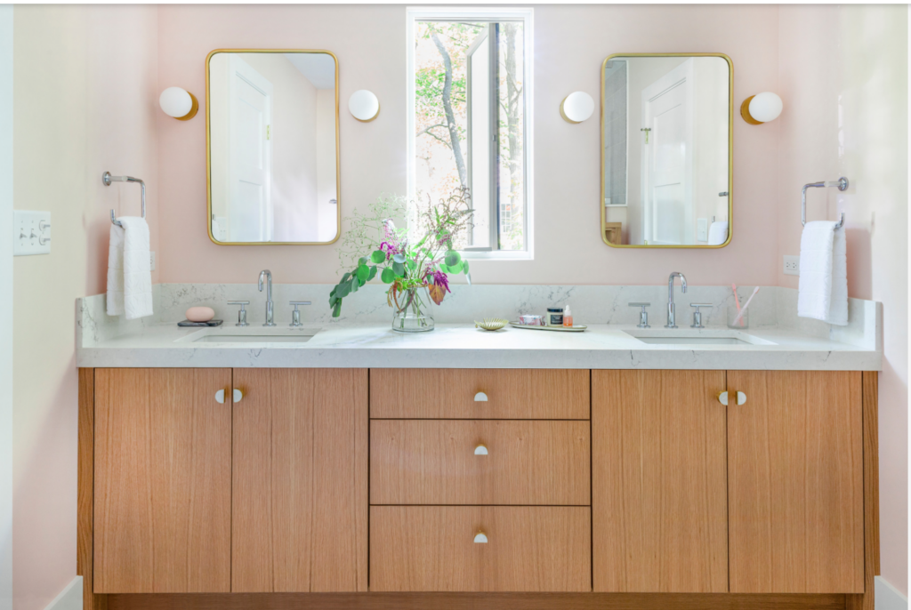 Light wood bathroom cabinets used in this small bathroom.
