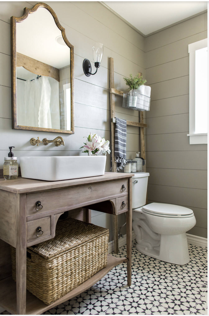 Weather wood bathroom cabinted in this small bathroom.